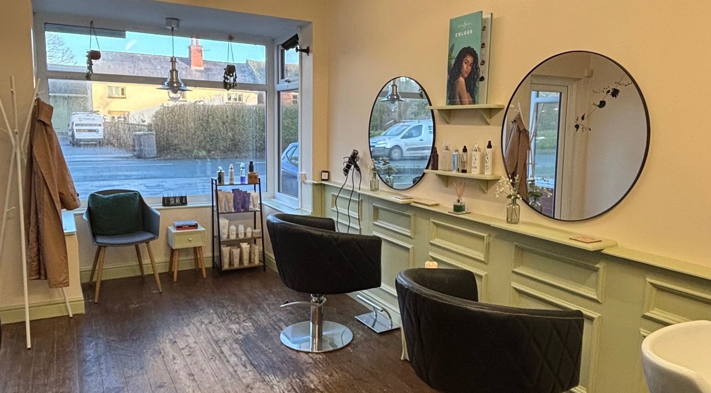 Niamh Elizabeth Hairdressing salon interior in Preston, England, GB, showcasing modern seating and stylish decor.