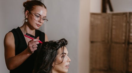 Stylist working on a client's hair at Niamh Elizabeth Hairdressing, Preston, England, GB.