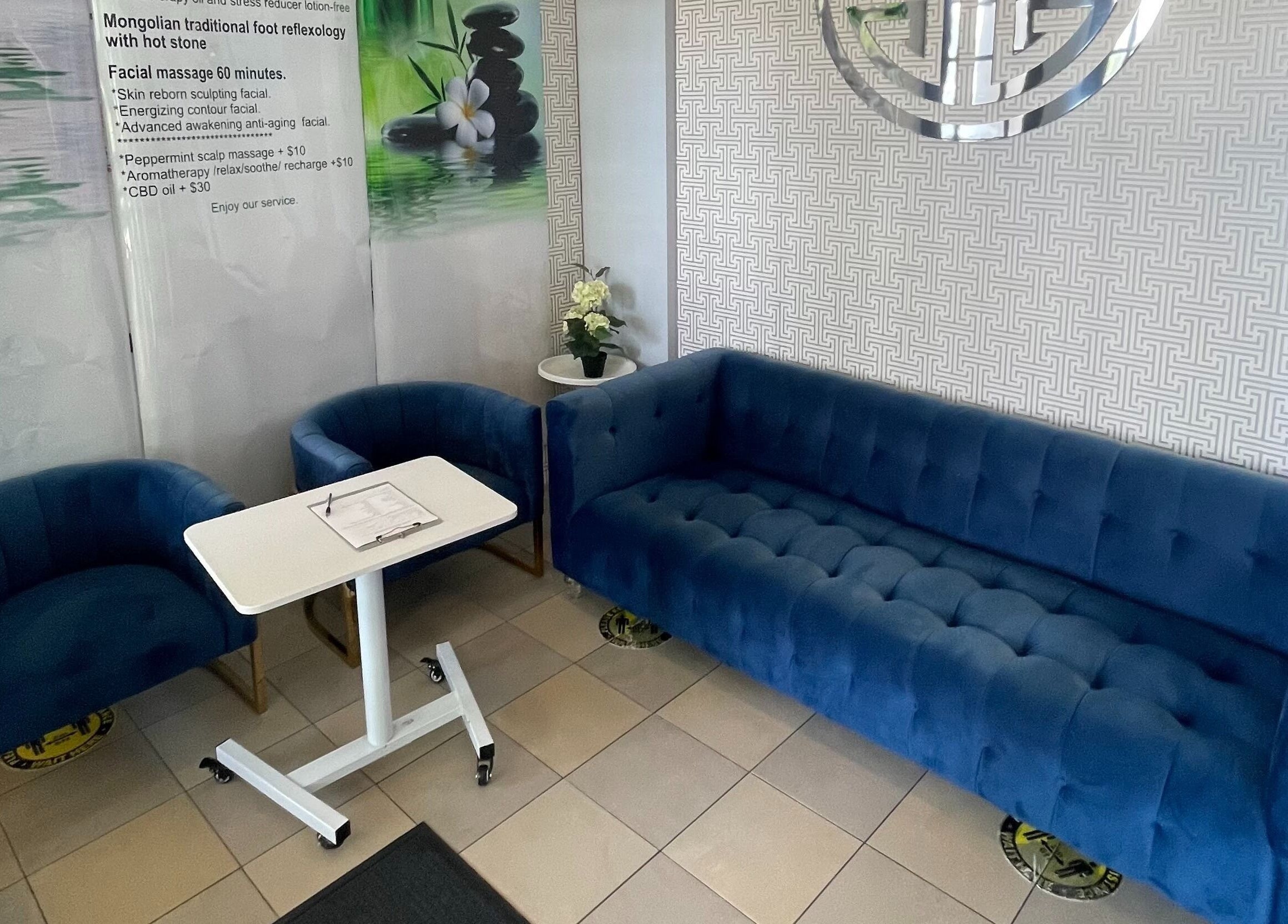 Elegant waiting area with blue sofas at Mongolian MassageLAB Skokie, Skokie, Illinois, US welcoming guests.