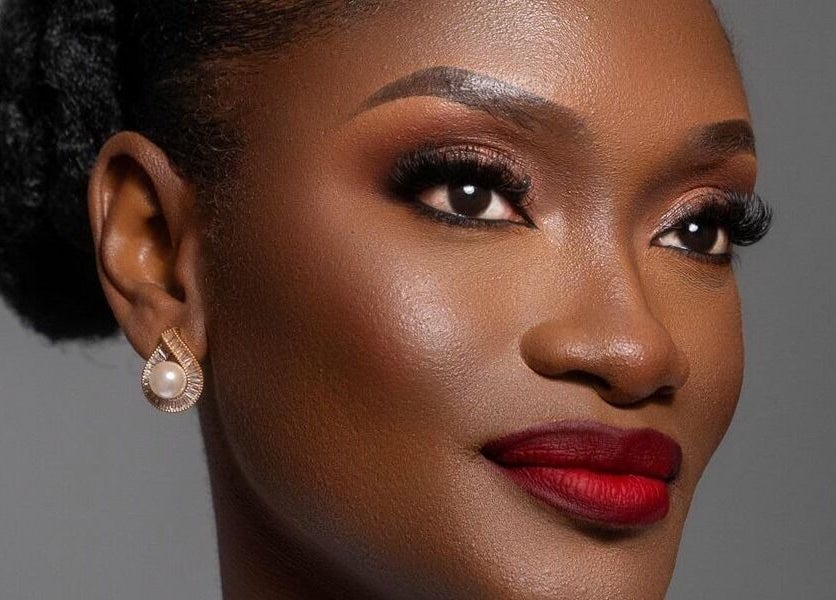 Elegant makeup look at Leessential Beauty Makeup Studio, Vreed En Hoop, GY, highlighting flawless skin and red lips.