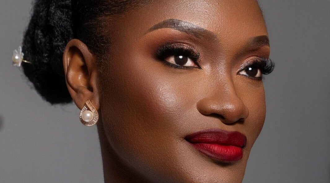 Elegant makeup look at Leessential Beauty Makeup Studio, Vreed En Hoop, GY, highlighting flawless skin and red lips.