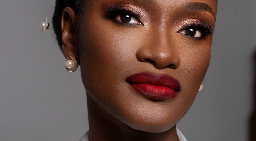 Flawless makeup at Leessential Beauty Makeup Studio, Vreed En Hoop, GY showcasing striking red lipstick.