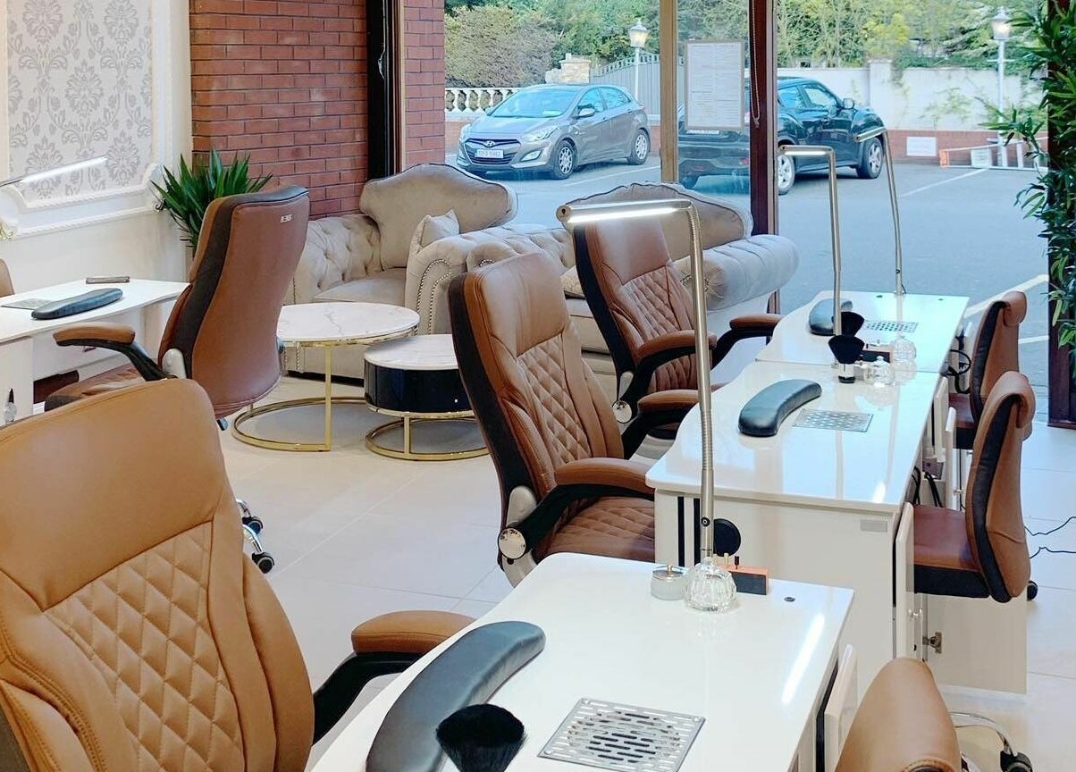 Chic interior of Lemon Hand and Foot Spa, Dublin, County Wicklow, IE, showcasing plush seating and manicure stations.