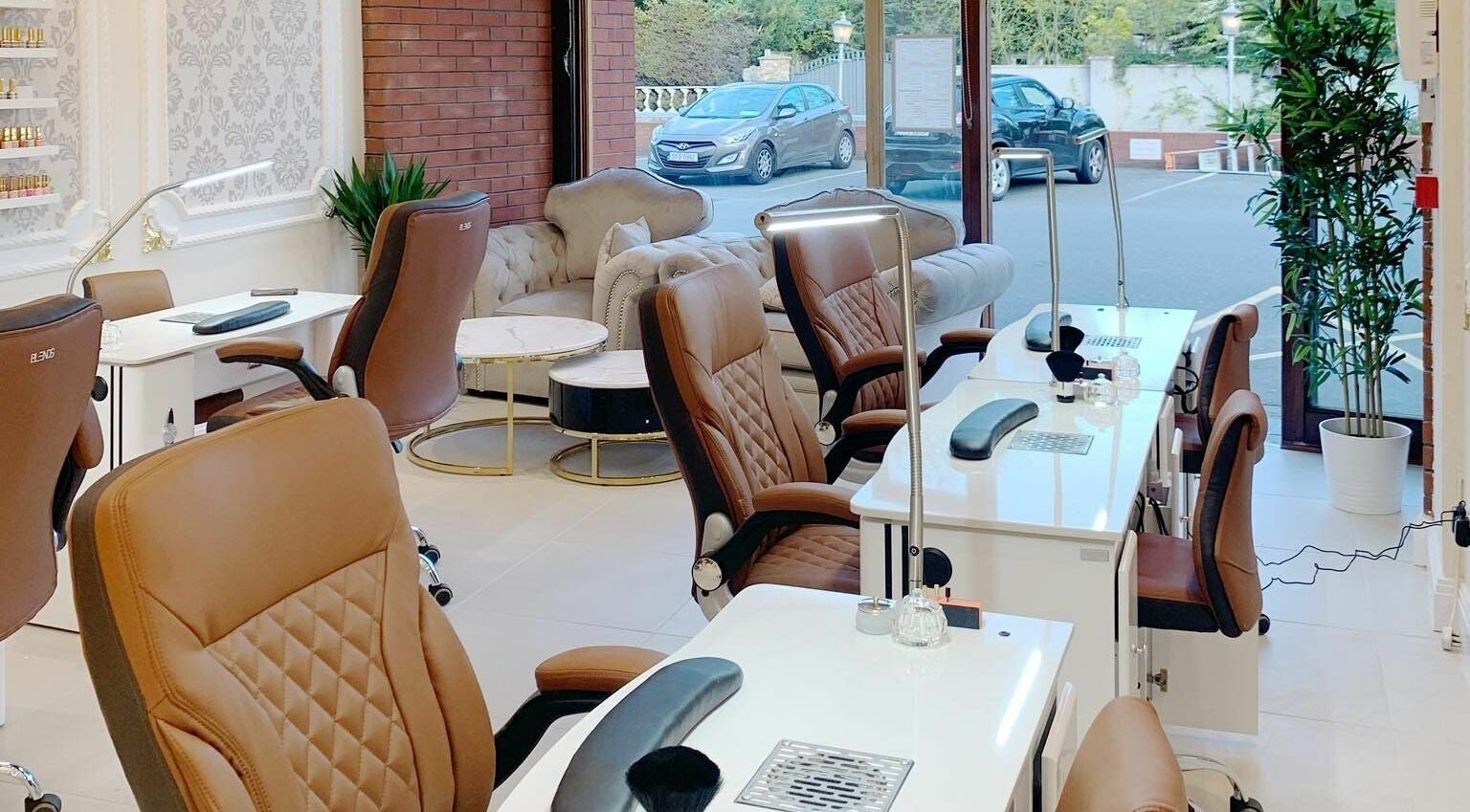 Chic interior of Lemon Hand and Foot Spa, Dublin, County Wicklow, IE, showcasing plush seating and manicure stations.
