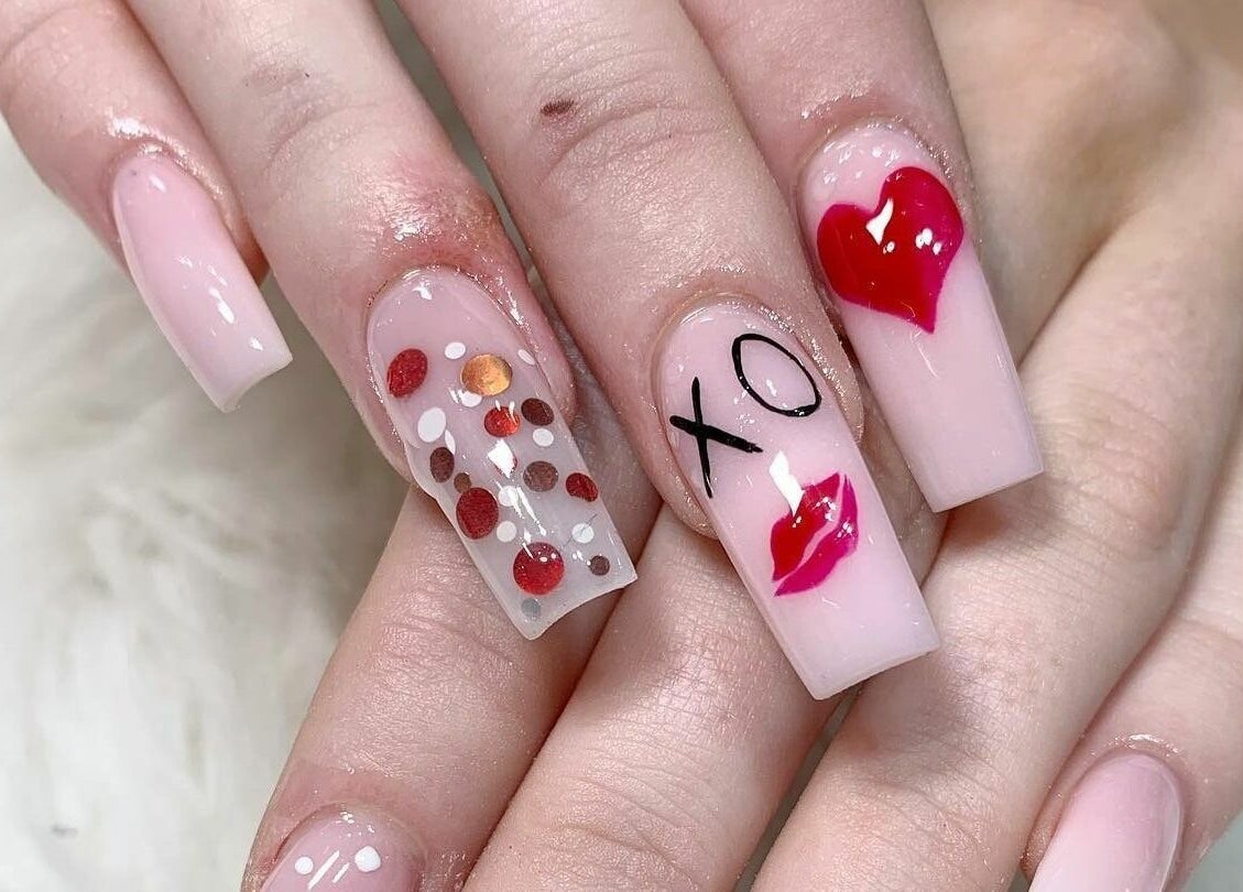 Stylish nail art at Lemon Hand and Foot Spa, Dublin, County Wicklow, IE, showcasing unique XO and heart designs.