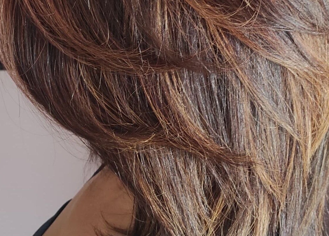 Elegant hair styling at Divas Only Mobile Salon, Cape Town, Western Cape, ZA. Highlighted brown layers.