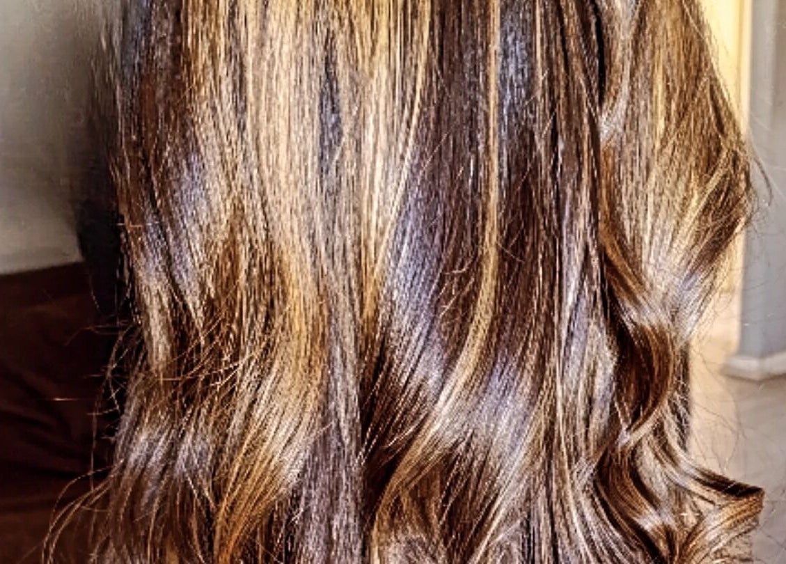 Elegant brown hair with highlights styled at Divas Only Mobile Salon, Cape Town, Western Cape, ZA.