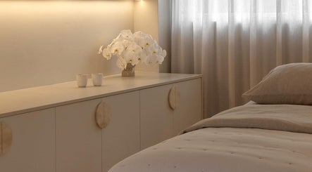 Relaxing room at Joanna Newham Skin Health, Avalon Beach, New South Wales, AU with elegant white decor.