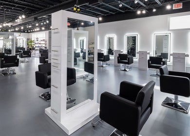 Sleek salon interior of Studio LaSalle in DENTON, United States, US, featuring modern styling stations.