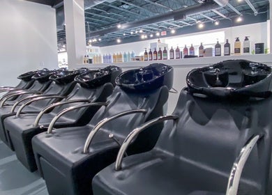 Modern hair wash stations at Studio LaSalle, DENTON, United States, US, showcasing elegance and functionality.