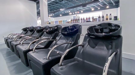 Modern hair wash stations at Studio LaSalle, DENTON, United States, US, showcasing elegance and functionality.