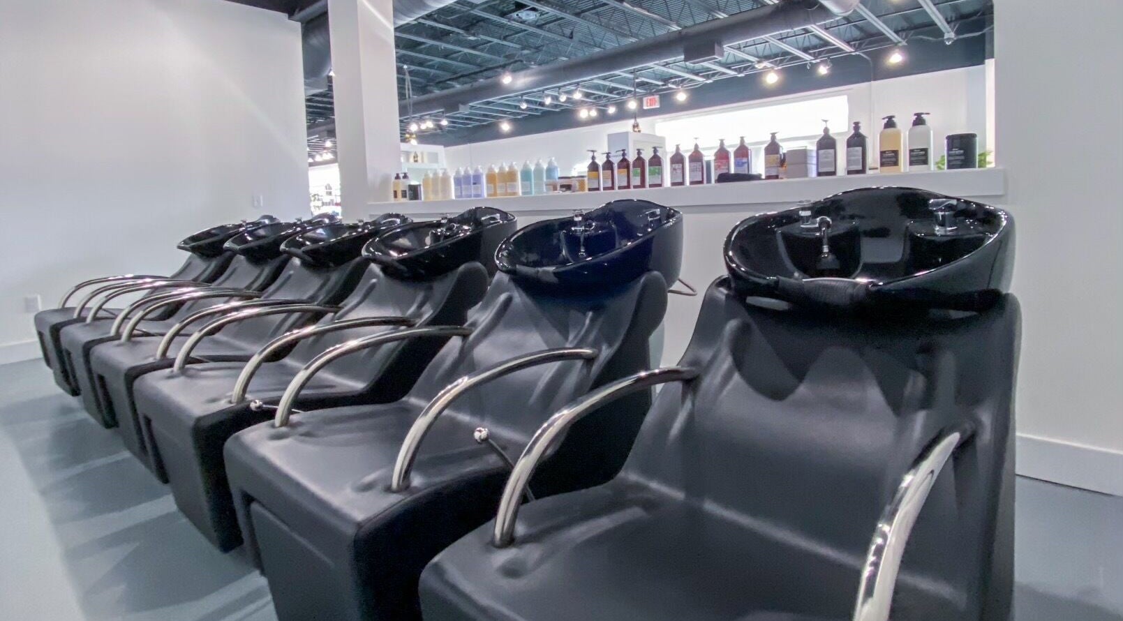 Modern hair wash stations at Studio LaSalle, DENTON, United States, US, showcasing elegance and functionality.