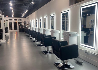 Sleek salon chairs and mirrors at Studio LaSalle in Denton, United States, US, showcasing modern elegance.