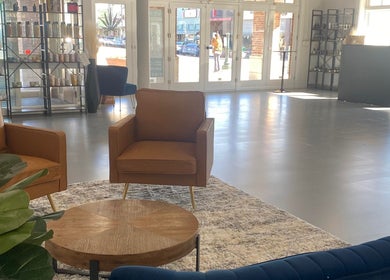 Elegant seating area in Studio LaSalle, DENTON, United States. Modern decor with cozy chairs and natural light.