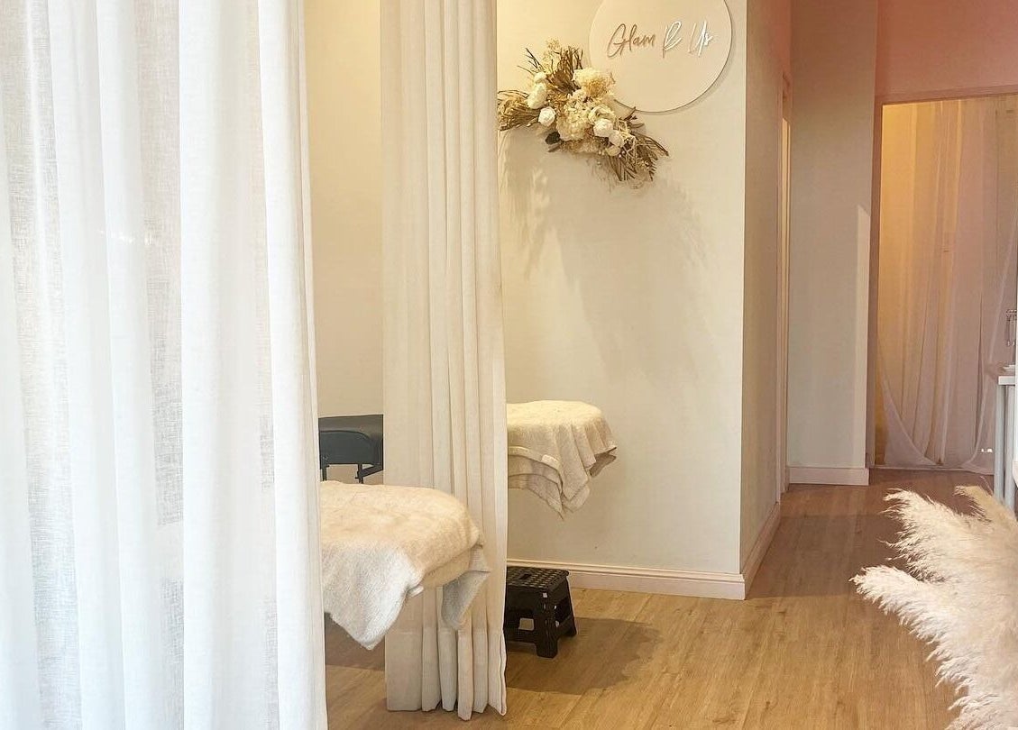 Relaxing spa room at Glam R Us Face and Body, Terrigal, New South Wales, AU, featuring elegant decor and soft lighting.
