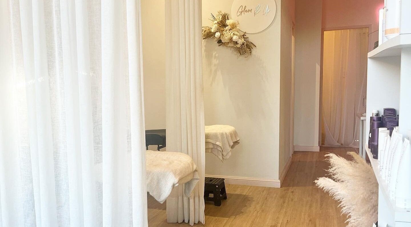 Relaxing spa room at Glam R Us Face and Body, Terrigal, New South Wales, AU, featuring elegant decor and soft lighting.