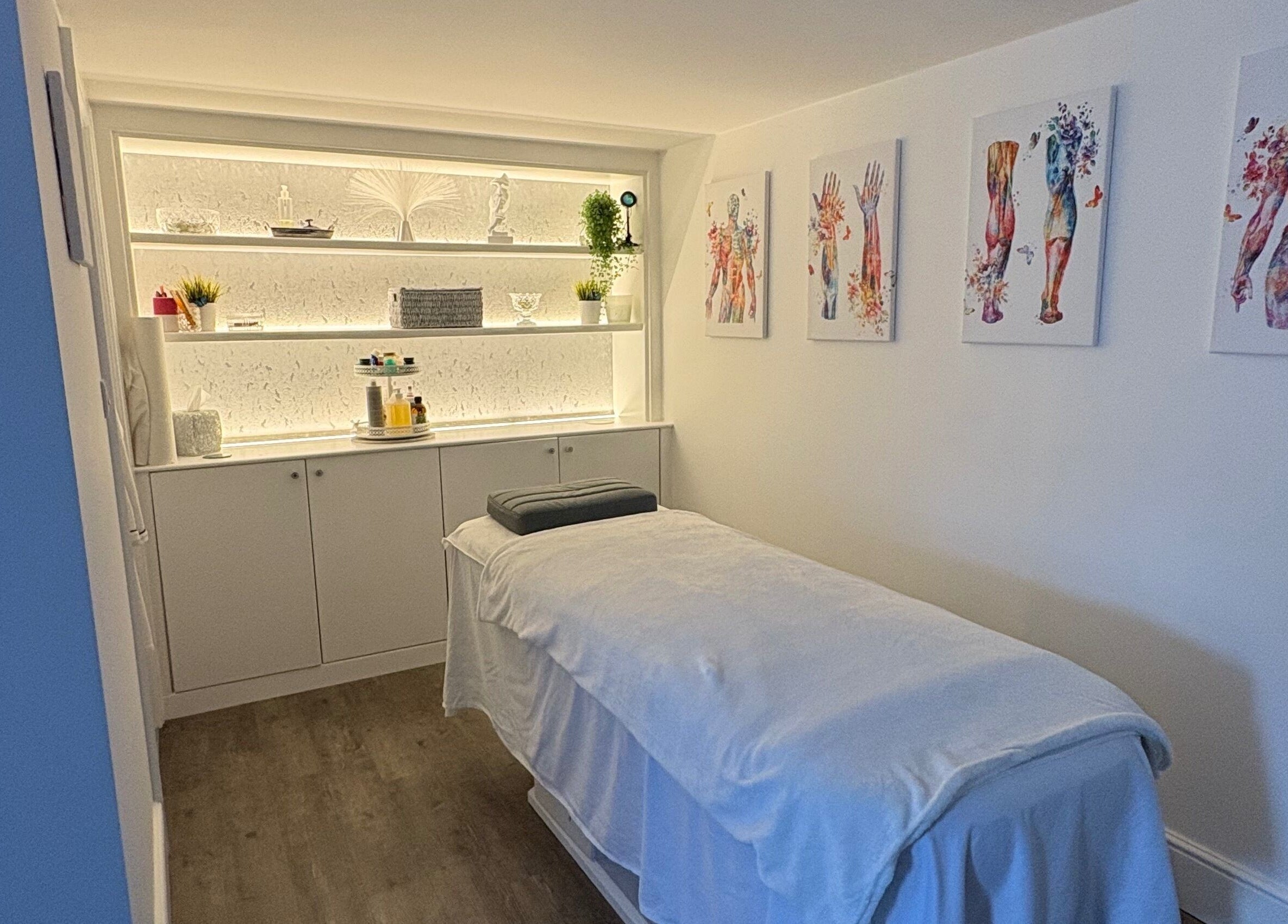 Relaxing treatment room at BodyLogic, Higham Ferrers, GB, featuring a cozy massage bed and calming decor.