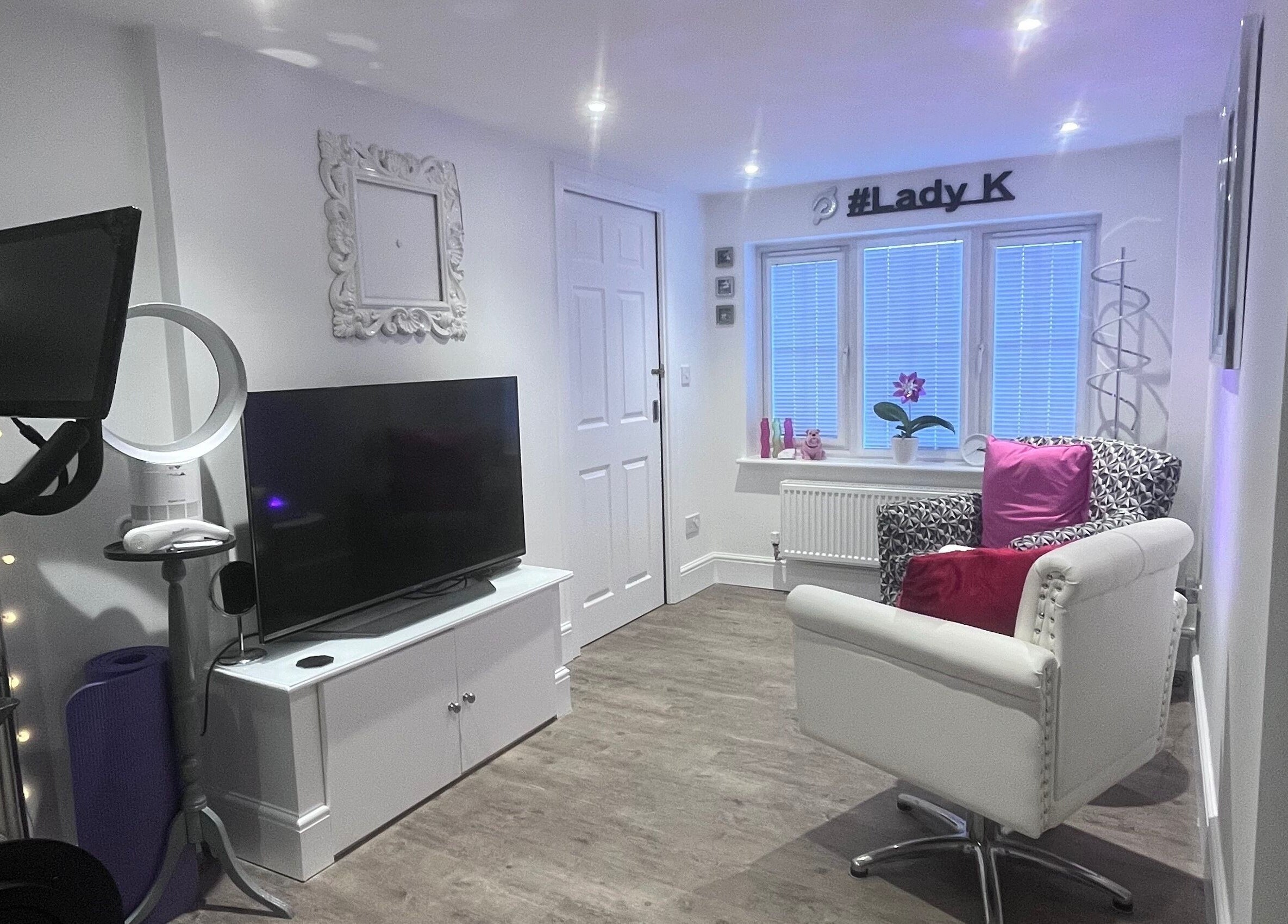 Modern, relaxing interior of BodyLogic beauty venue in Higham Ferrers, GB, featuring cozy seating and decor.