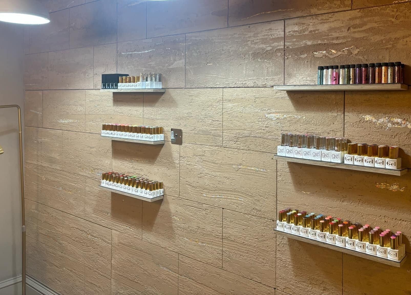 Gel polish collection at The salon Tillicoultry, Tillicoultry, Scotland, GB on elegant wall shelves.