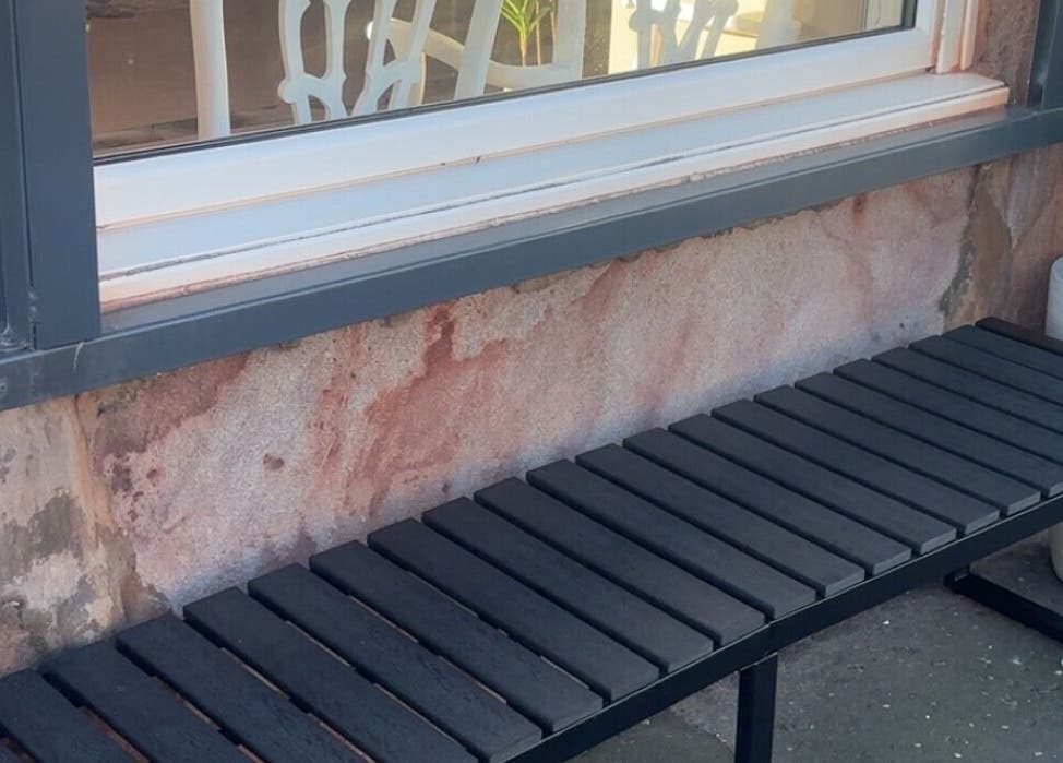 Outdoor black bench by the window of The salon Tillicoultry, Tillicoultry, Scotland, GB.