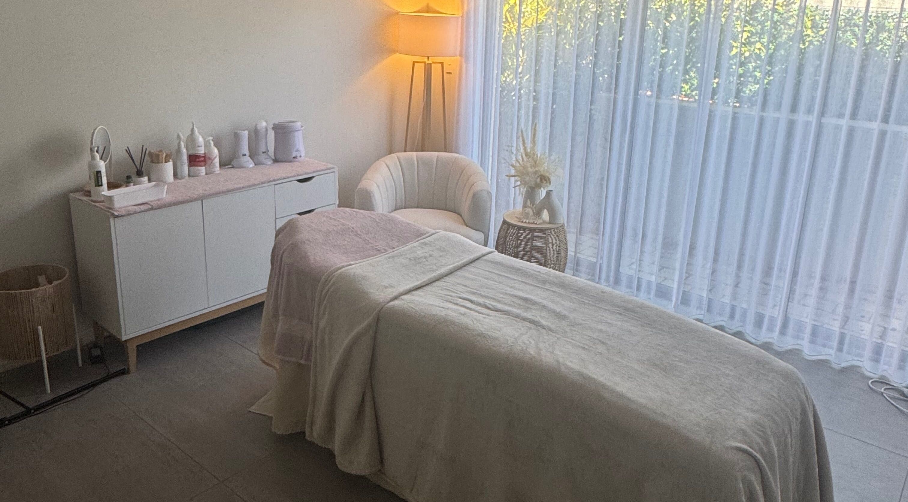 Relaxing treatment room at Sharn's Beauty Room, Bennett Springs, Western Australia, AU with spa bed and soothing decor.