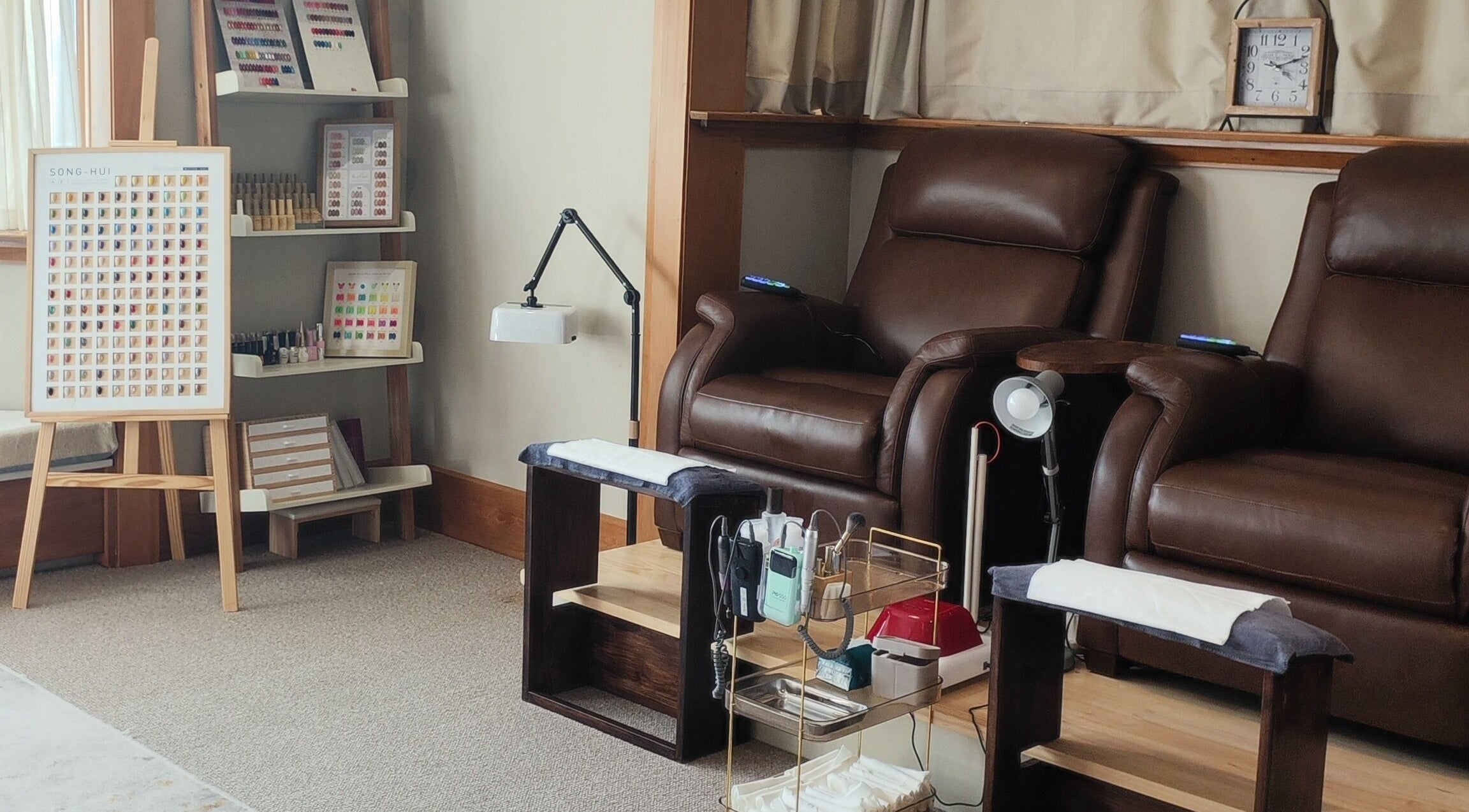 Luxurious pedicure chairs and nail polish display at Nine Moons Nail Salon, Christchurch, Canterbury, NZ.