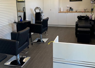 Chic salon interior at Hair Studio 13 in Nabiac, New South Wales, AU with modern styling chairs.