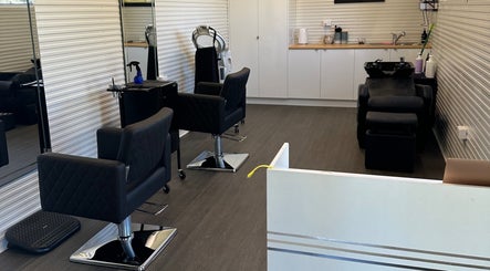 Chic salon interior at Hair Studio 13 in Nabiac, New South Wales, AU with modern styling chairs.