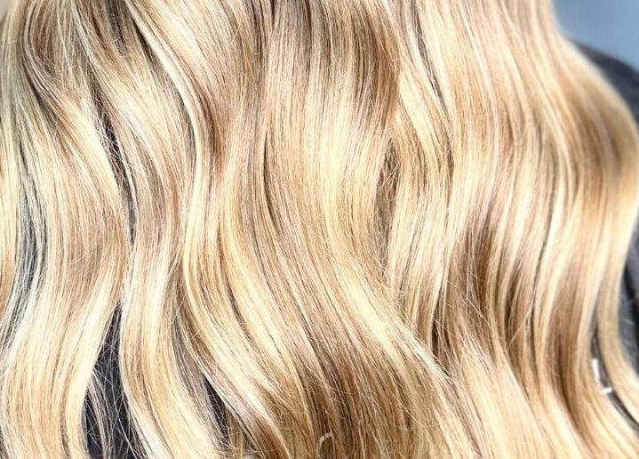 Blonde wavy hairstyle treatment at Bonds Aesthetics, The Royal Town of Sutton Coldfield, England, GB.