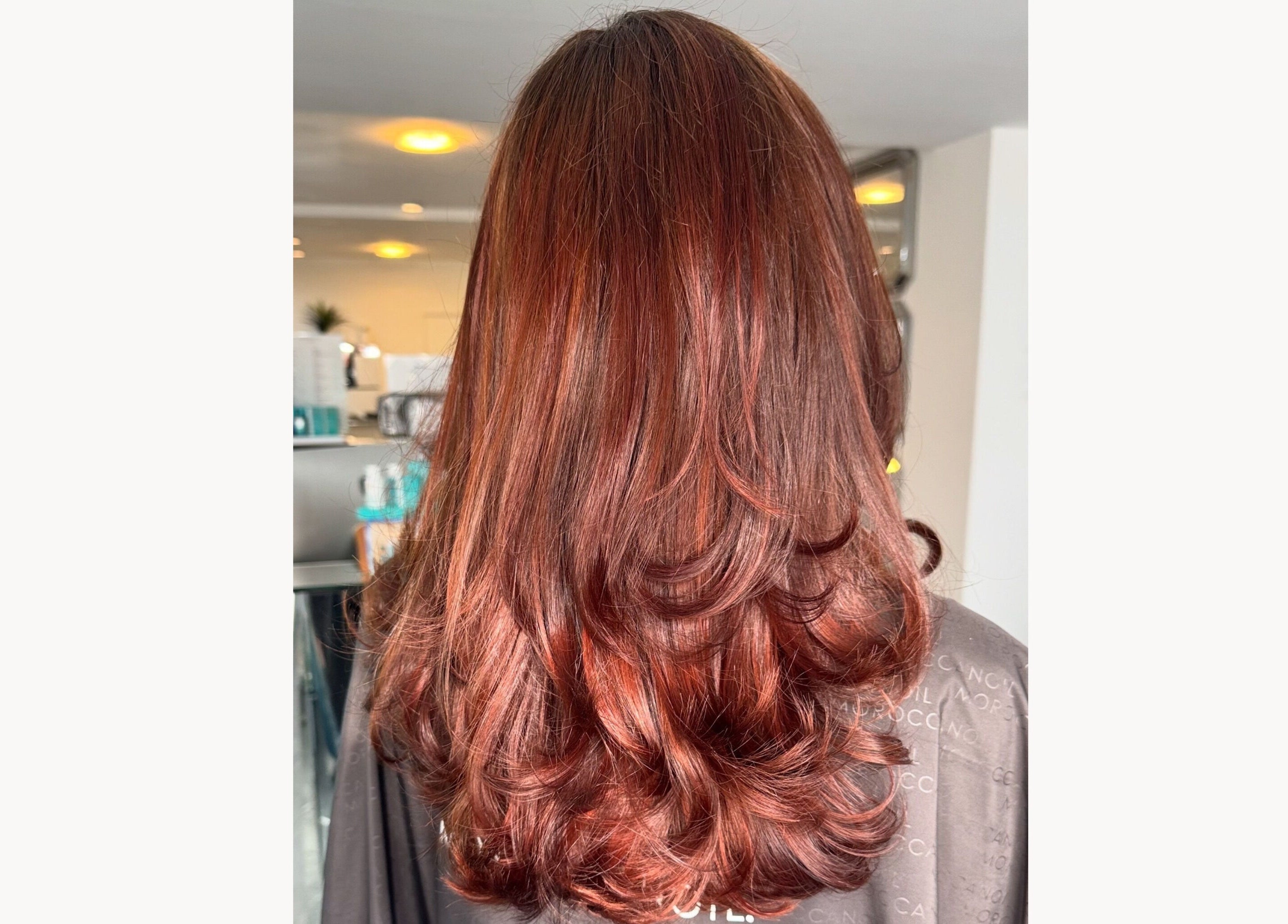 Lustrous auburn curls at Bonds Aesthetics, The Royal Town of Sutton Coldfield, England, GB.
