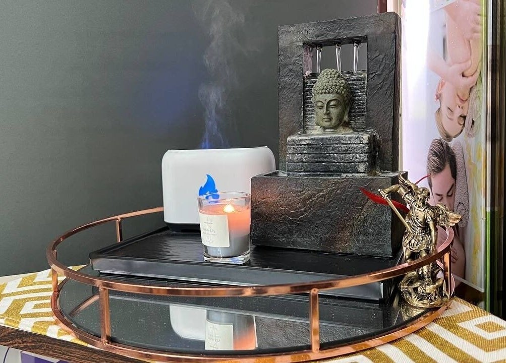 Peaceful decorative tray with candle and statue at Mio Spa Studio, Caracas, Miranda, VE.
