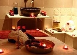 Relaxing candle-lit massage room at Ayana Spa Muscat in Muscat, Muscat Governorate, OM for ultimate wellness.