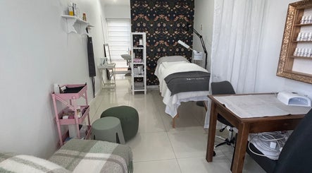 Interior of Gentle Radiance Beauty Salon in Gqeberha, Eastern Cape, ZA featuring treatment bed and decor.