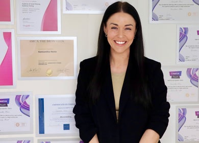 Professional at Bows Beauty & Aesthetics in Bognor Regis, England with displayed beauty certificates.