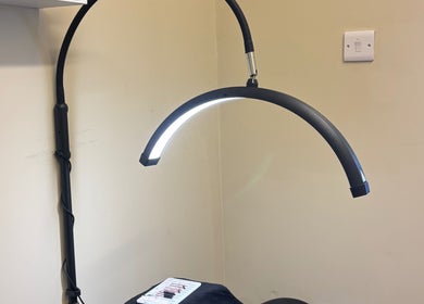 Modern lamp over beauty treatment area at Beauty by loz, Exeter, England, GB.
