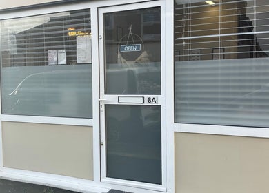 Entrance of Beauty by loz, a cozy salon located at Exeter, England, GB, featuring a welcoming open sign.