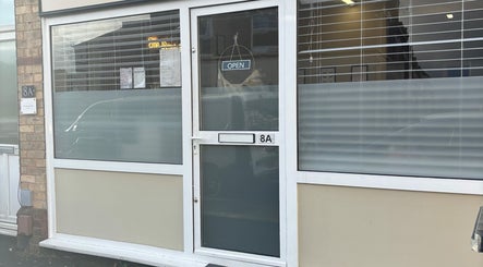 Entrance of Beauty by loz, a cozy salon located at Exeter, England, GB, featuring a welcoming open sign.