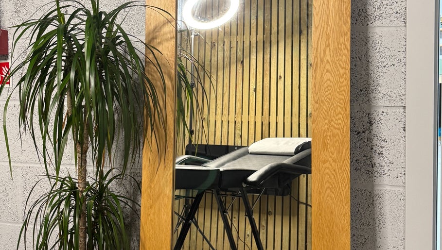 Contemporary salon setup with mirror and chair at KIKI Beauty, Sheffield, England, GB.