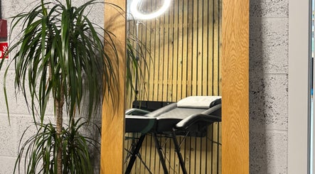 Contemporary salon setup with mirror and chair at KIKI Beauty, Sheffield, England, GB.