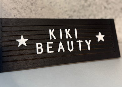 KIKI Beauty logo on a sleek black sign at Sheffield, England, GB, capturing elegance and style.