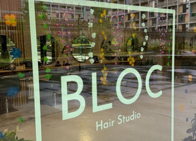 Reflection of BLOC Hair Studio's stylish interior at KIKI Beauty, Sheffield, England, GB with floral decor.