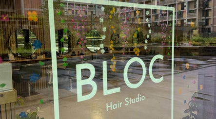 Reflection of BLOC Hair Studio's stylish interior at KIKI Beauty, Sheffield, England, GB with floral decor.