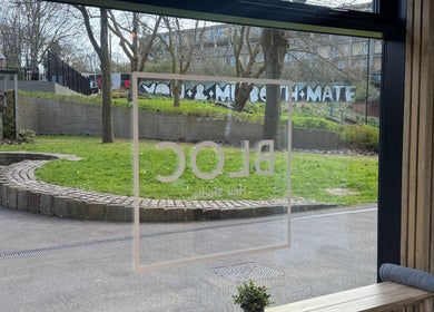 View from KIKI Beauty Sheffield, England, GB showcasing serene outdoor greenery through salon window.