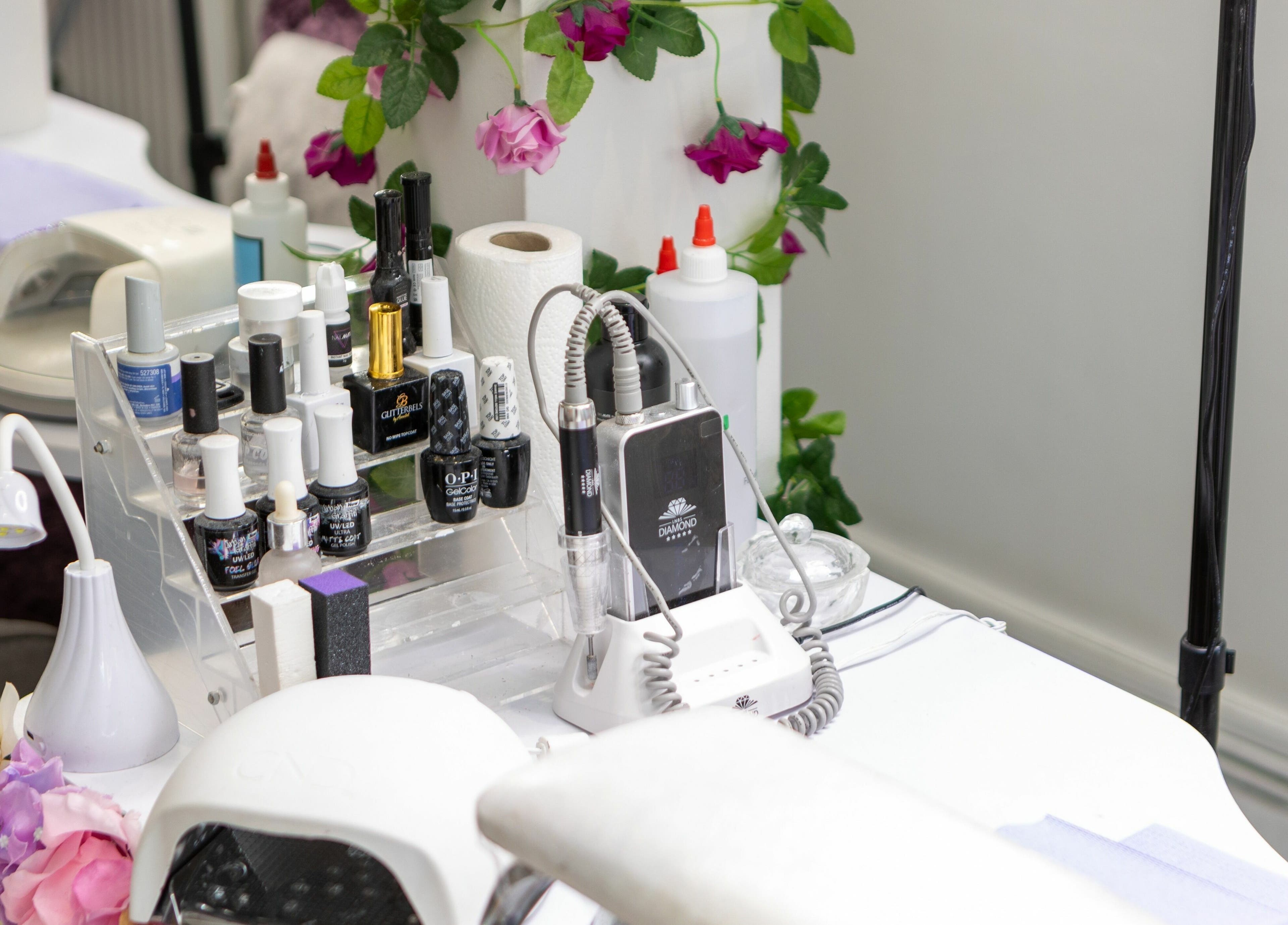 Nail station setup at 10:15 Aesthetics with floral decor in London, England, GB.