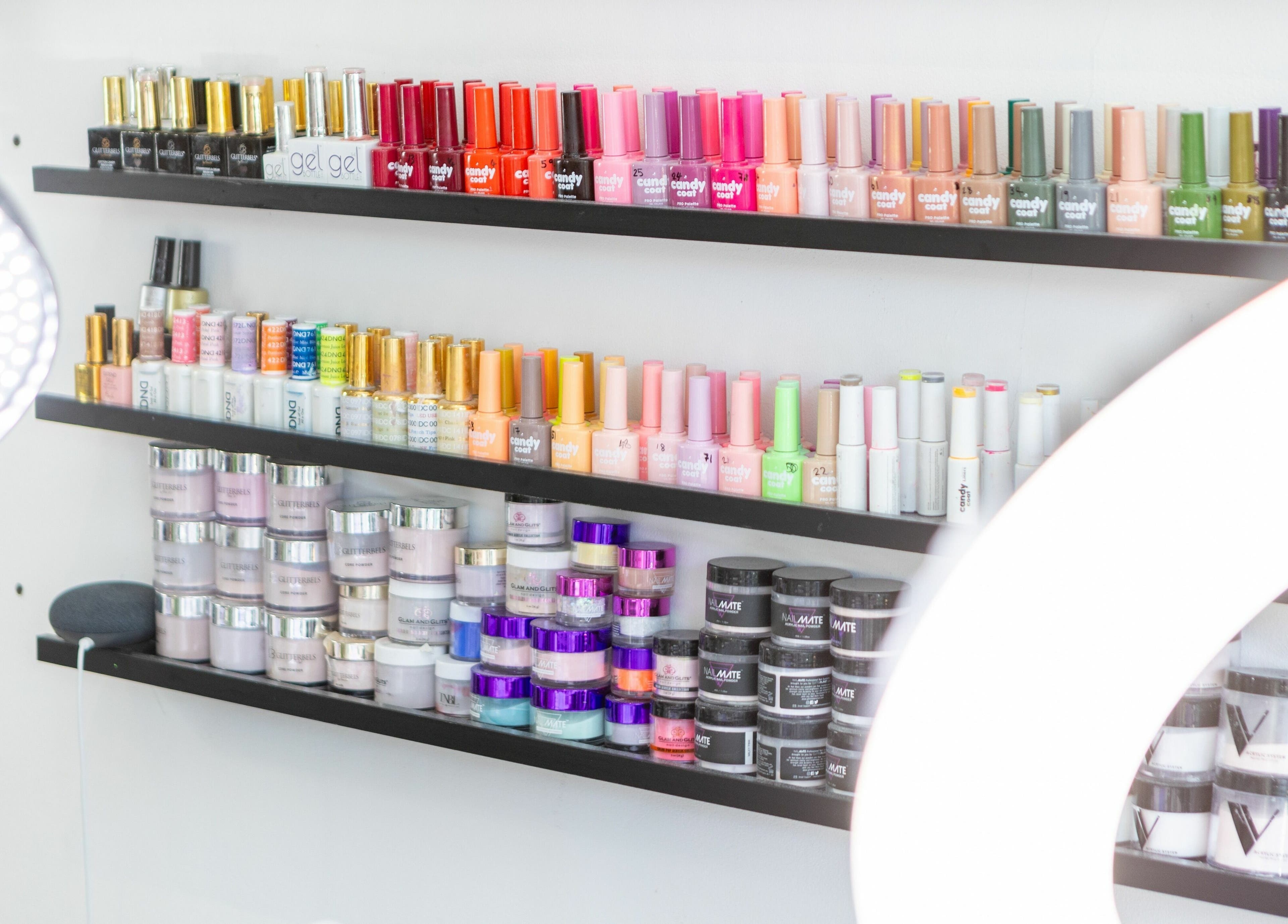 Colorful nail polish display at 10:15 Aesthetics, London, England, GB, offers a wide variety of shades.