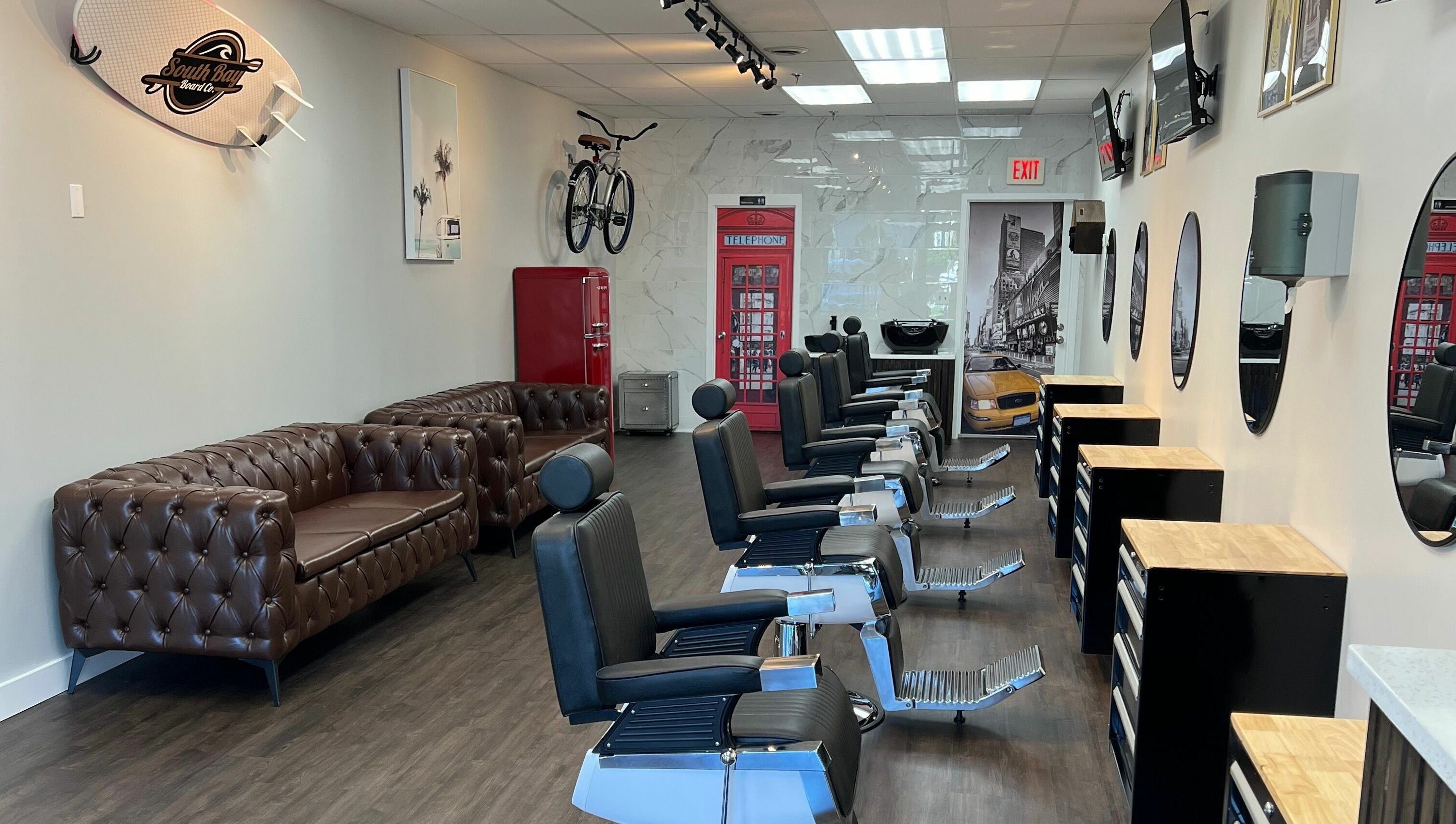 Stylish interior of Art Zone Barbering in Massachusetts featuring classic barber chairs and decor.
