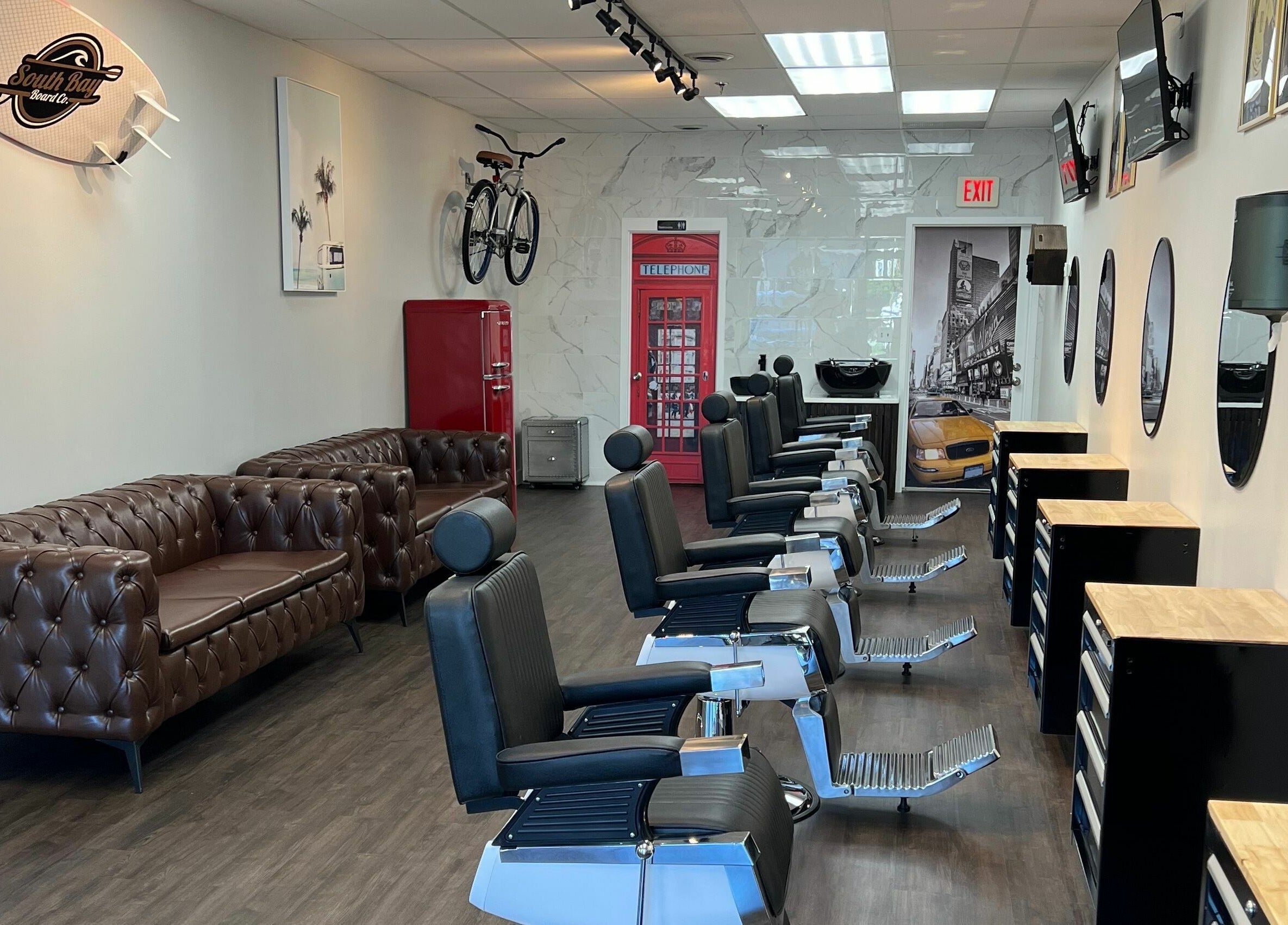 Stylish interior of Art Zone Barbering in Massachusetts featuring classic barber chairs and decor.