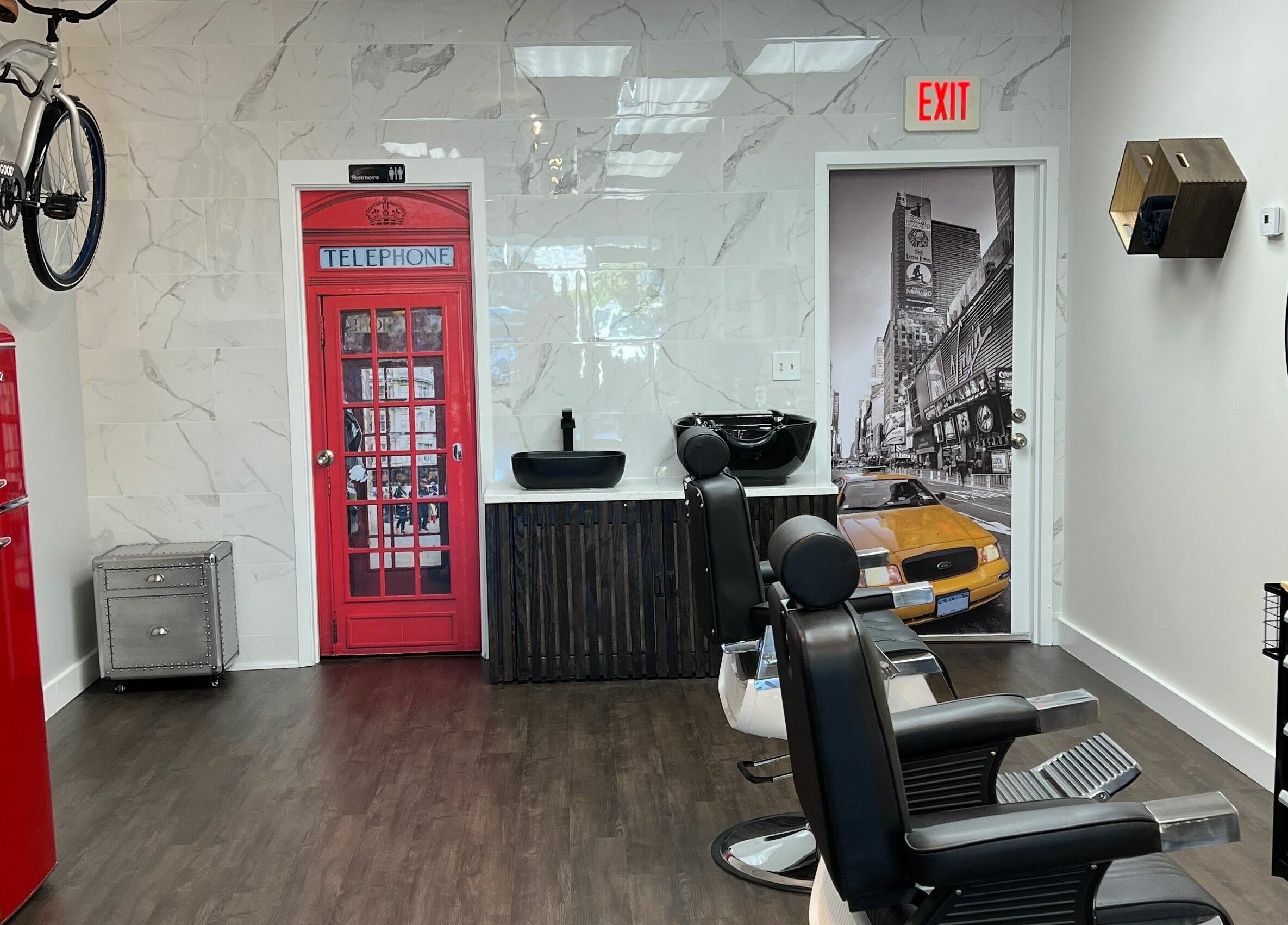 Modern interior of Art Zone Barbering in Massachusetts, US with stylish decor and comfortable seating.