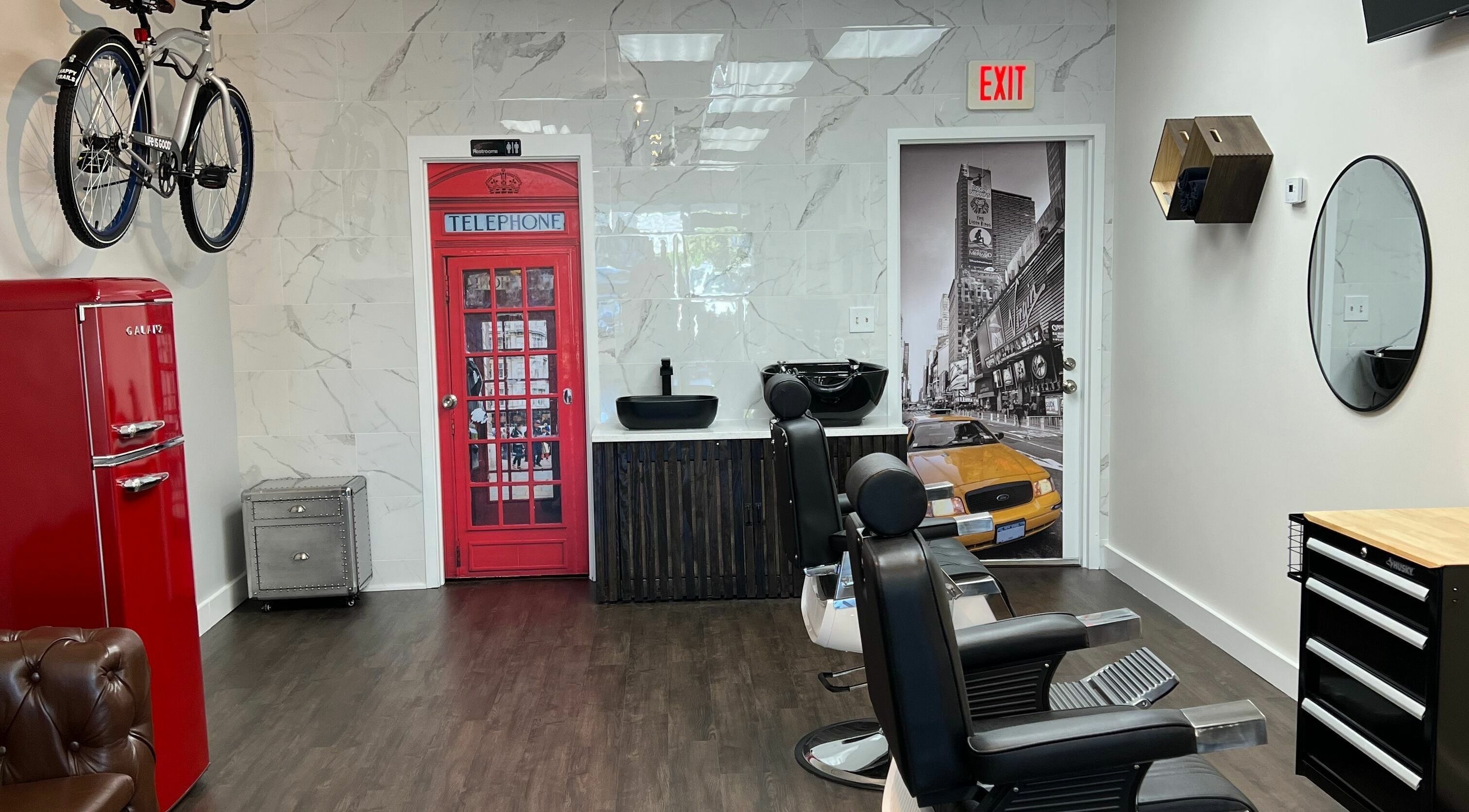 Modern interior of Art Zone Barbering in Massachusetts, US with stylish decor and comfortable seating.