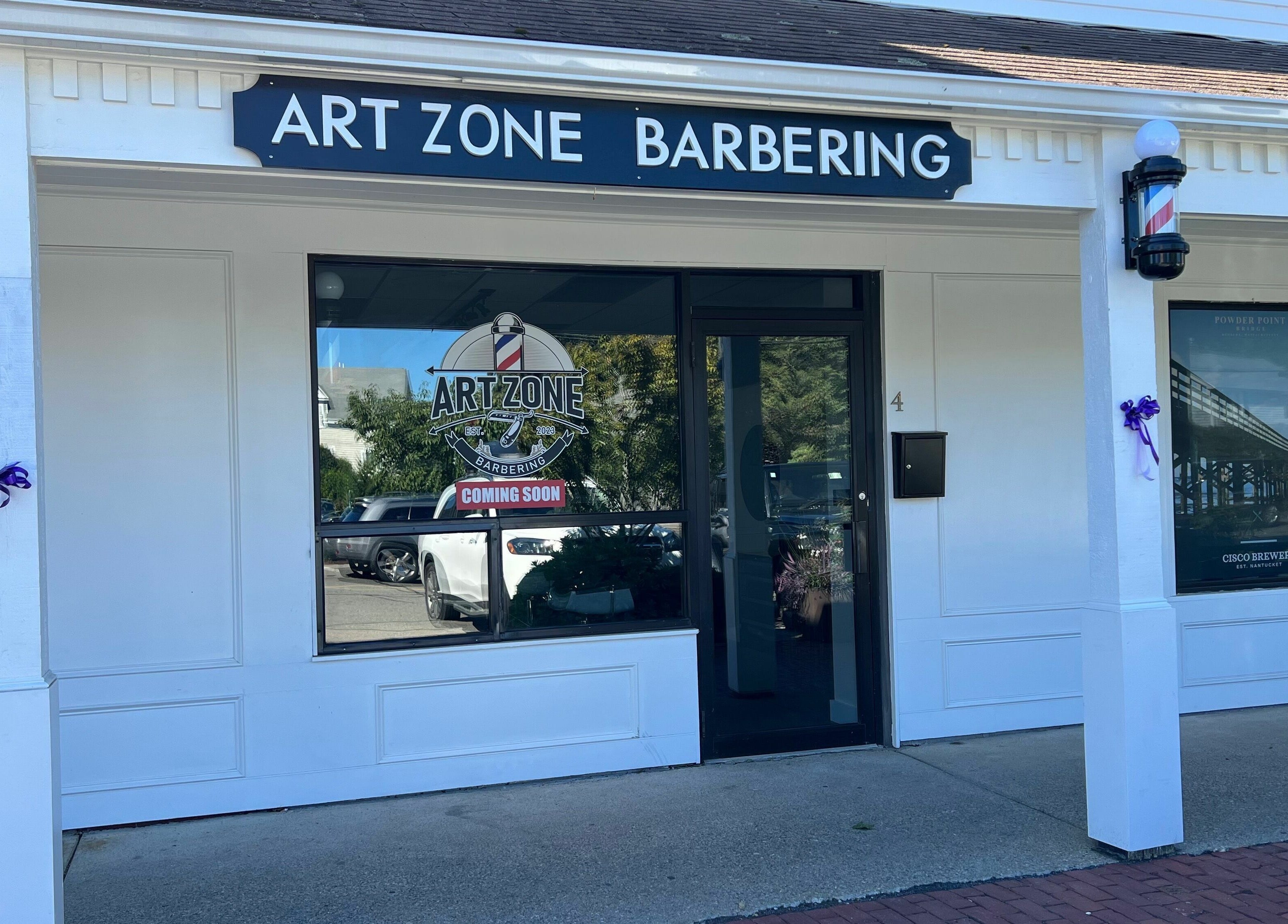 Entrance of Art Zone Barbering in Massachusetts, Massachusetts, US features modern design and welcoming ambiance.